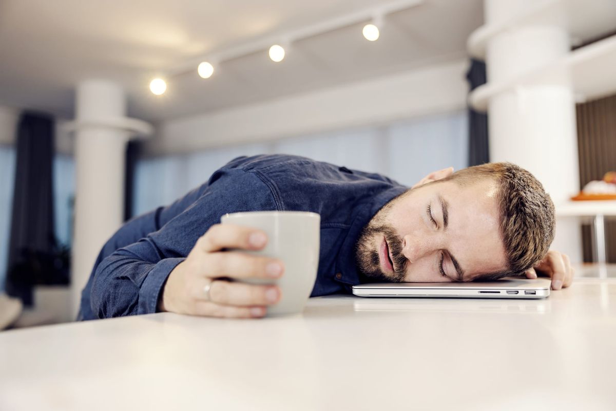 Man sleeping on his laptop